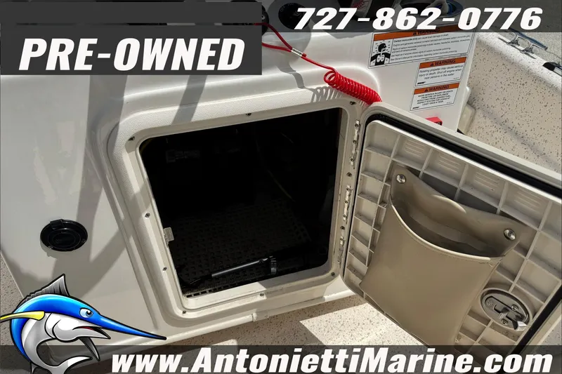 Slide: The Image of Pre-owned 2019 Carolina Skiff 18 JVX CC boat storage compartment, contact Antonietti Marine. - 19
