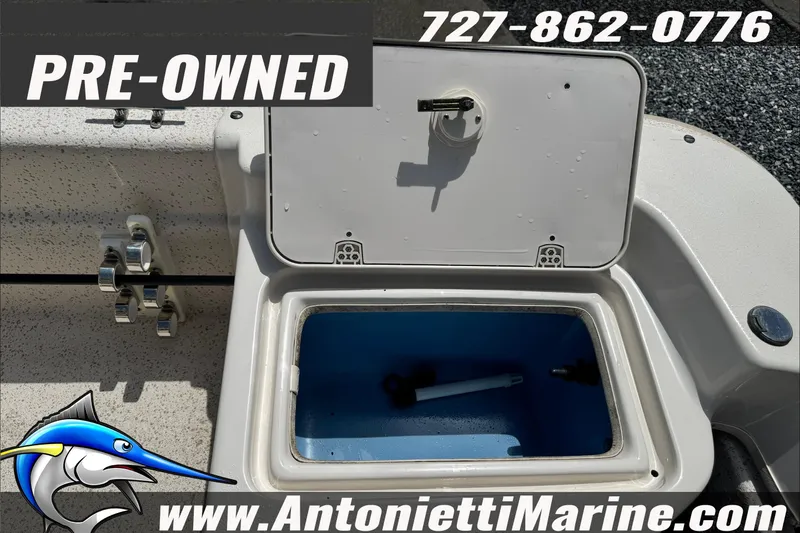 Slide: The Image of Pre-owned 2019 Carolina Skiff 18 JVX CC boat with open storage compartment. - 21