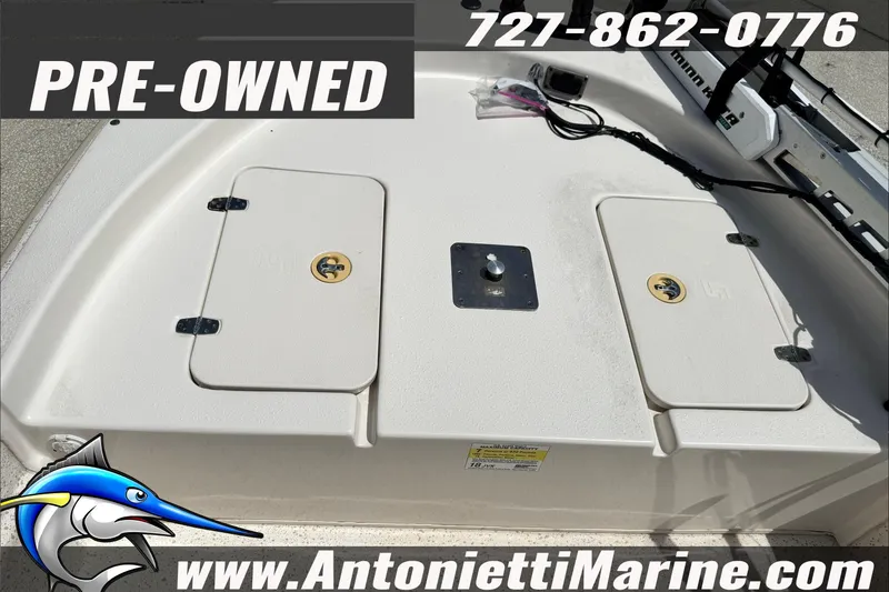 Slide: The Image of Pre-owned 2019 Carolina Skiff 18 JVX CC boat deck with storage compartments. - 25