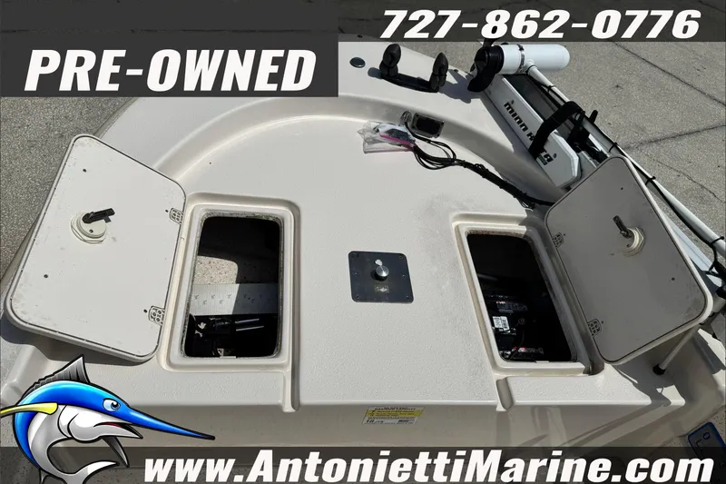 Slide: The Image of Pre-owned 2019 Carolina Skiff 18 JVX CC boat with storage compartments open. - 26