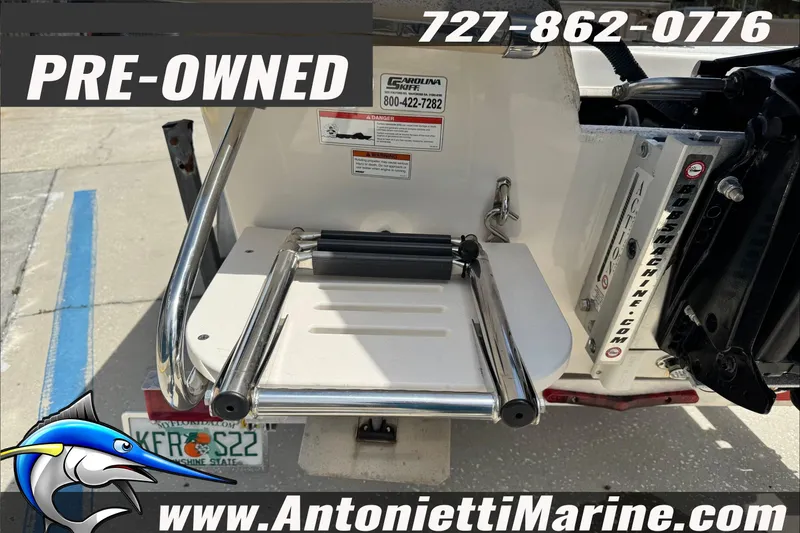 Slide: The Image of Pre-owned 2019 Carolina Skiff 18 JVX CC boat with ladder and contact details. - 8