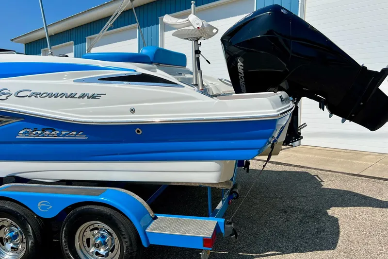 Slide: The Image of 2020 Crownline Eclipse E205 XS Fish boat with Mercury outboard motor on trailer. - 16