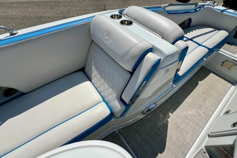 Slide: The Image of 2020 Crownline Eclipse E205 XS Fish boat interior with white and blue seating. - 20