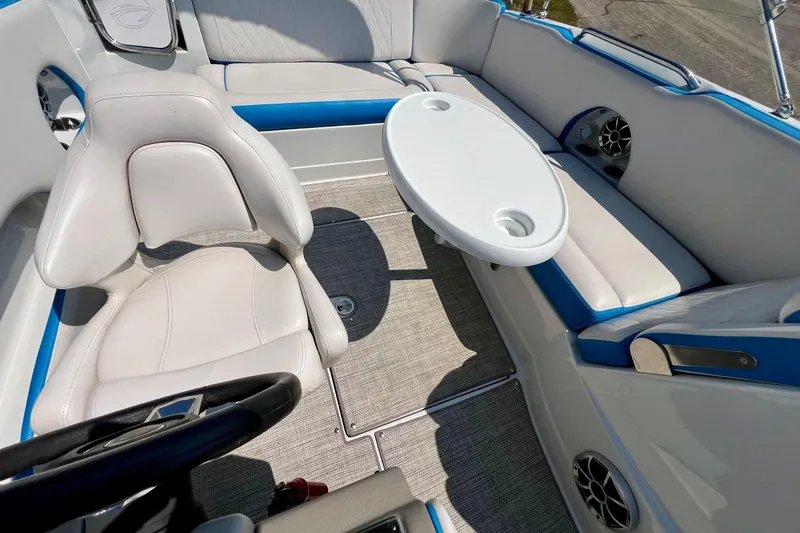 Slide: The Image of 2020 Crownline Eclipse E205 XS Fish boat interior with seating and table. - 21
