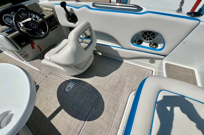 Slide: The Image of 2020 Crownline Eclipse E205 XS Fish boat interior with steering wheel and seating. - 23