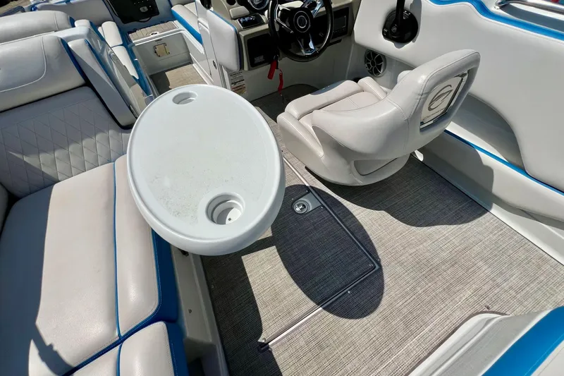 Slide: The Image of 2020 Crownline Eclipse E205 XS Fish boat interior with seating and steering wheel. - 24
