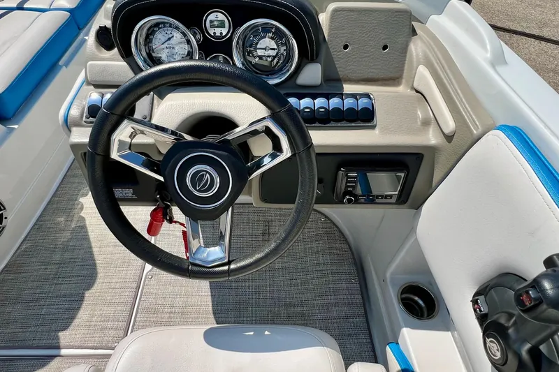Slide: The Image of 2020 Crownline Eclipse E205 XS Fish boat dashboard with steering wheel and controls. - 25