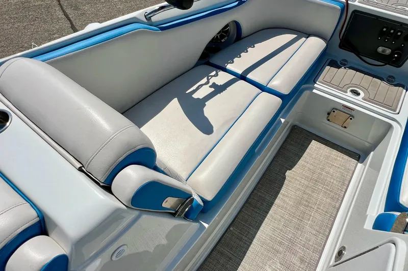 Slide: The Image of 2020 Crownline Eclipse E205 XS Fish boat interior with cushioned seating and storage. - 26