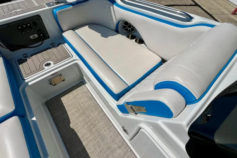 Slide: The Image of 2020 Crownline Eclipse E205 XS Fish boat interior with blue and white seating. - 28