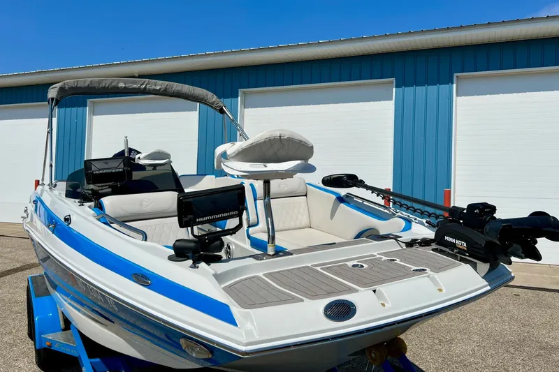 Slide: The Image of 2020 Crownline Eclipse E205 XS Fish boat with fishing equipment and blue accents. - 3