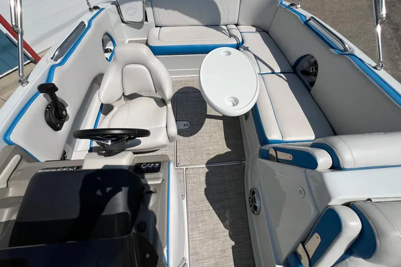 Slide: The Image of 2020 Crownline Eclipse E205 XS Fish boat interior with seating and steering wheel. - 32