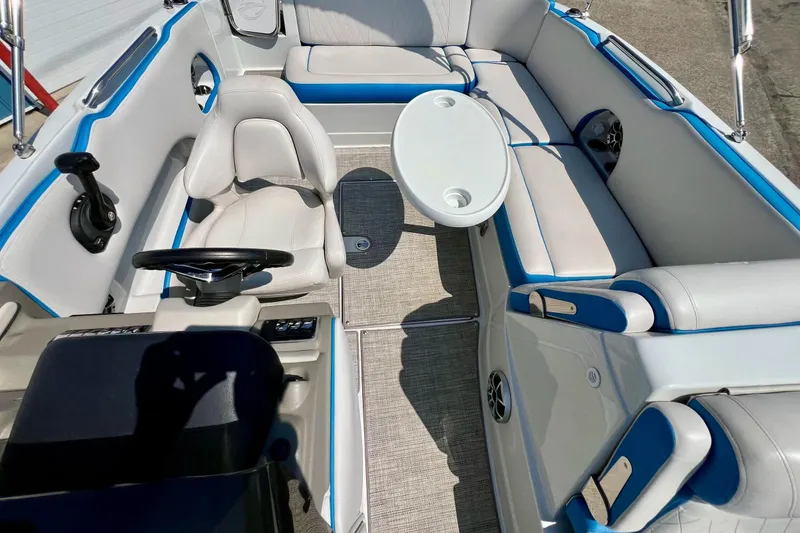 Slide: The Image of 2020 Crownline Eclipse E205 XS Fish boat interior with seating and steering wheel. - 33