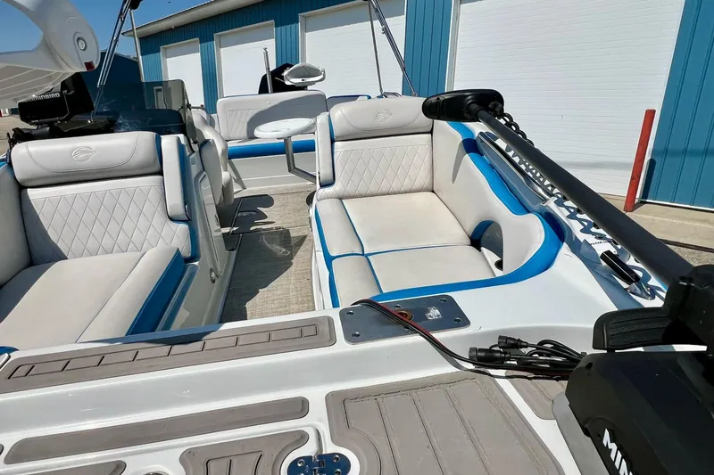 Slide: The Image of 2020 Crownline Eclipse E205 XS Fish boat interior with blue and white seating. - 7