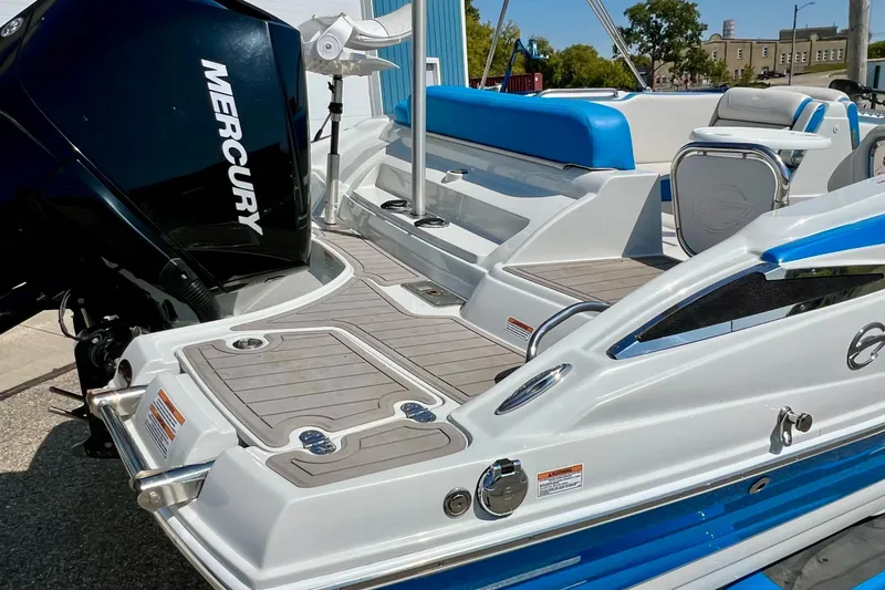 Slide: The Image of 2020 Crownline Eclipse E205 XS Fish boat with Mercury engine, featuring sleek design and seating. - 9