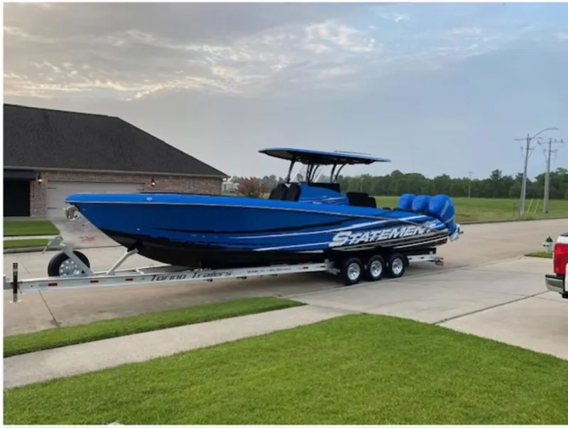 The Image of Blue 2021 Statement 380 Open boat on trailer in suburban driveway. - 0