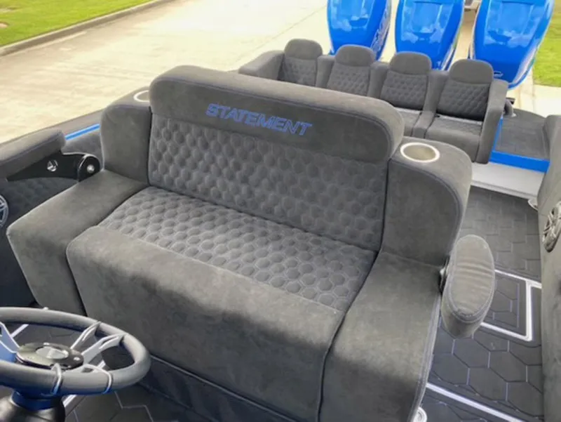 Slide: The Image of Luxurious seating on 2021 Statement 380 Open boat with plush upholstery and cup holders. - 11