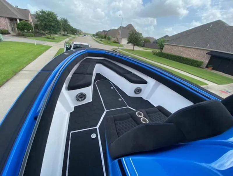 Slide: The Image of Blue 2021 Statement 380 Open boat with sleek interior design on a suburban street. - 4
