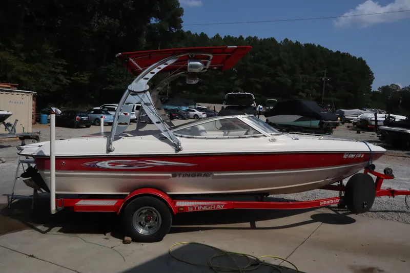The Image of 2008 Stingray 195 LS/LX/LR boat on trailer, parked outdoors. - 0