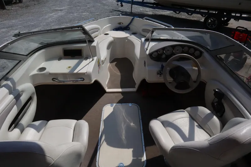 Slide: The Image of 2008 Stingray 195 LS/LX/LR boat interior with steering wheel and seating arrangement. - 15