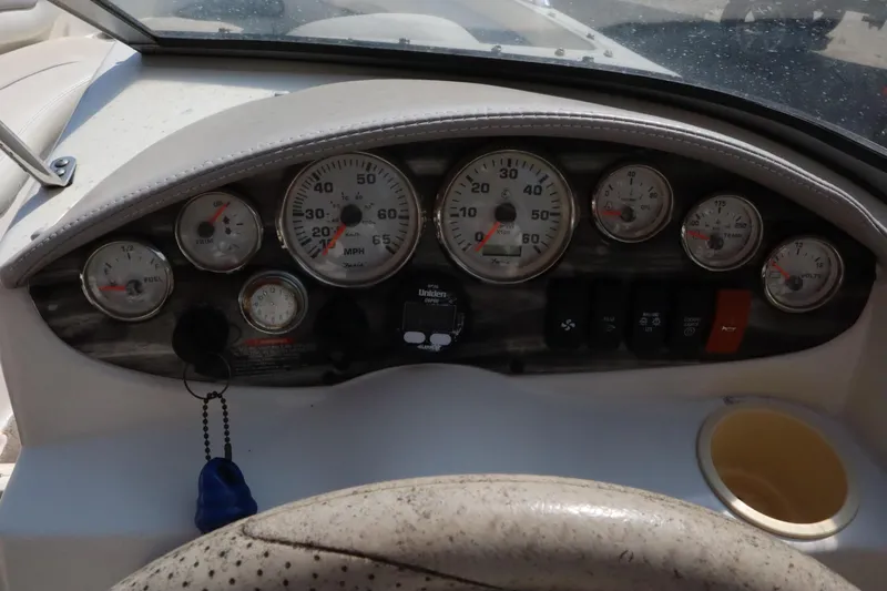 Slide: The Image of Dashboard of a 2008 Stingray 195 LS/LX/LR boat with gauges and controls. - 18