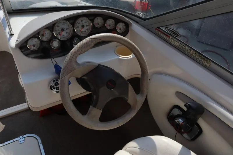 Slide: The Image of 2008 Stingray 195 LS/LX/LR boat dashboard with steering wheel and gauges. - 19
