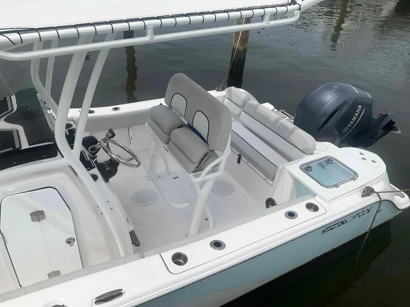 Slide: The Image of 2023 Sea Fox 228 Commander boat with Yamaha 200 engine docked in water. - 17