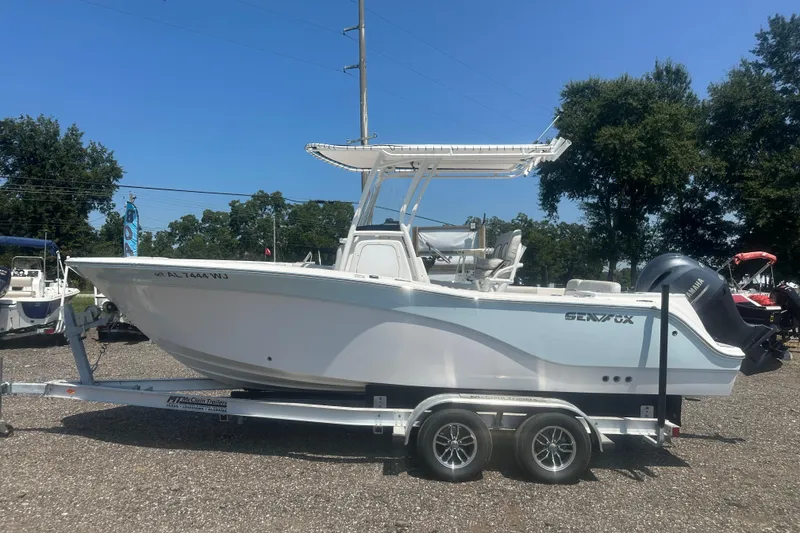 Slide: The Image of 2023 Sea Fox 228 Commander boat interior with cushioned seating and cup holders. - 23