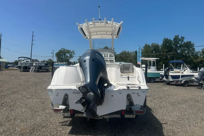 Slide: The Image of 2023 Sea Fox 228 Commander boat with Yamaha 200 engine, docked on water. - 26