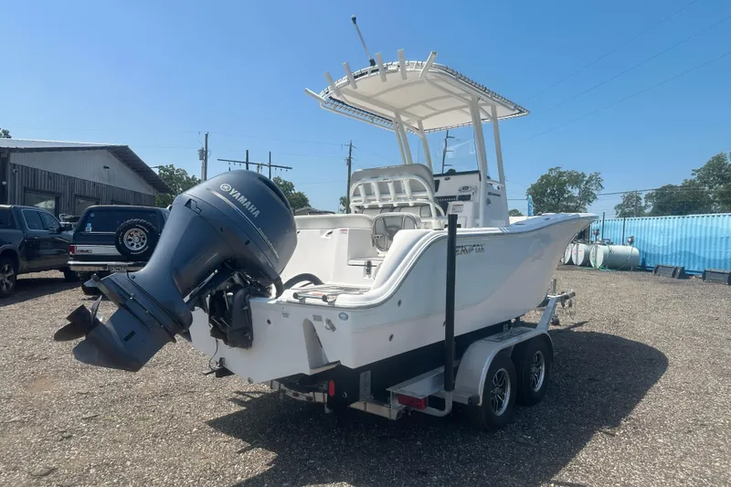 Slide: The Image of 2023 Sea Fox 228 Commander boat console with steering wheel and navigation controls. - 27