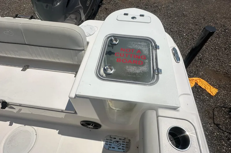 Slide: The Image of 2023 Sea Fox 228 Commander boat interior with seating and engine view. - 43