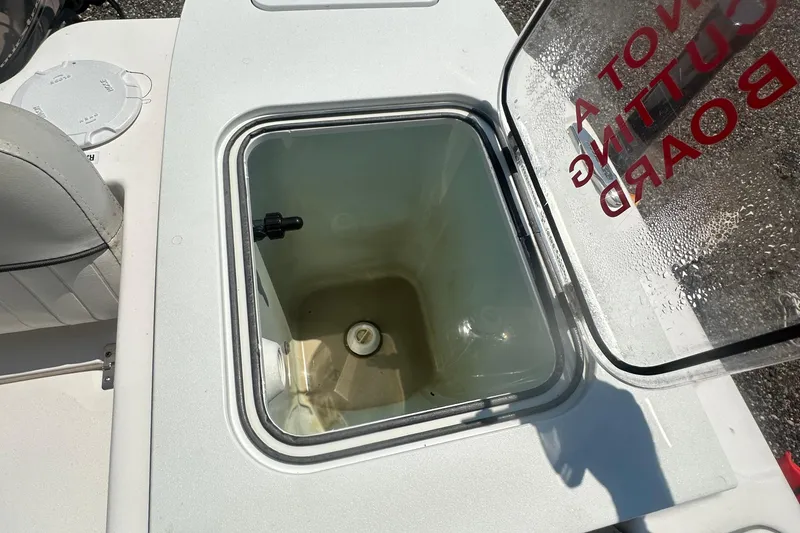 Slide: The Image of 2023 Sea Fox 228 Commander boat deck with coiled blue hose and seating. - 45