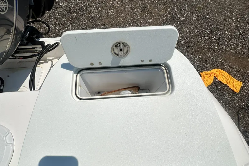 Slide: The Image of Open storage compartment on 2023 Sea Fox 228 Commander boat deck. - 47