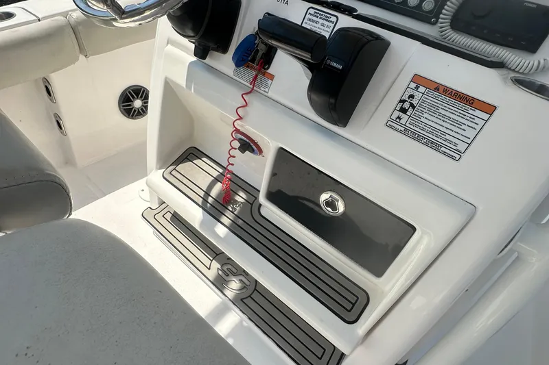 Slide: The Image of 2023 Sea Fox 228 Commander boat interior with safety lanyard and control panel. - 49