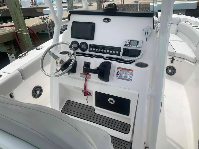 Slide: The Image of 2023 Sea Fox 228 Commander boat on trailer, parked outdoors under clear sky. - 7