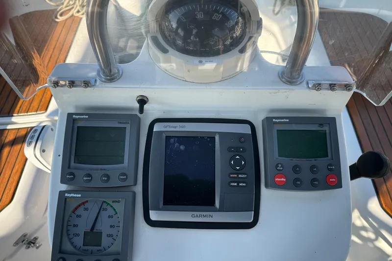 Slide: The Image of Control panel of a 2004 Beneteau 361 sailboat with navigation instruments. - 10