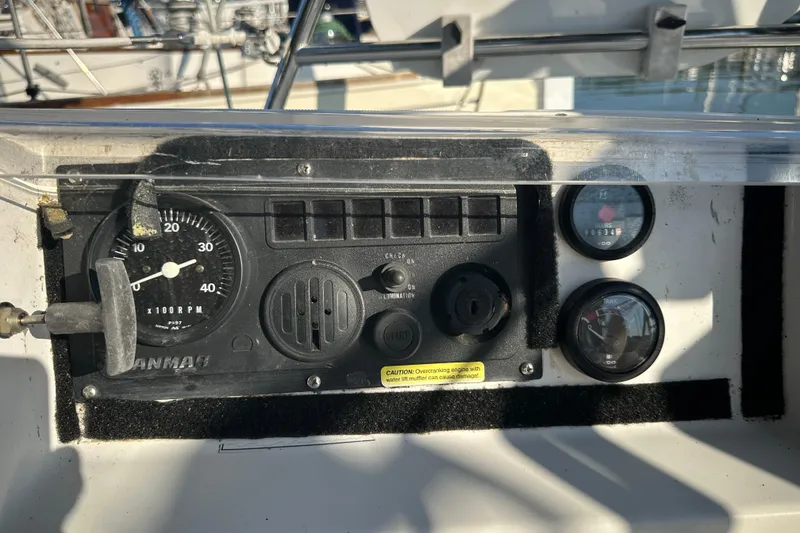 Slide: The Image of Control panel of a 2004 Beneteau 361 sailboat with gauges and switches. - 11