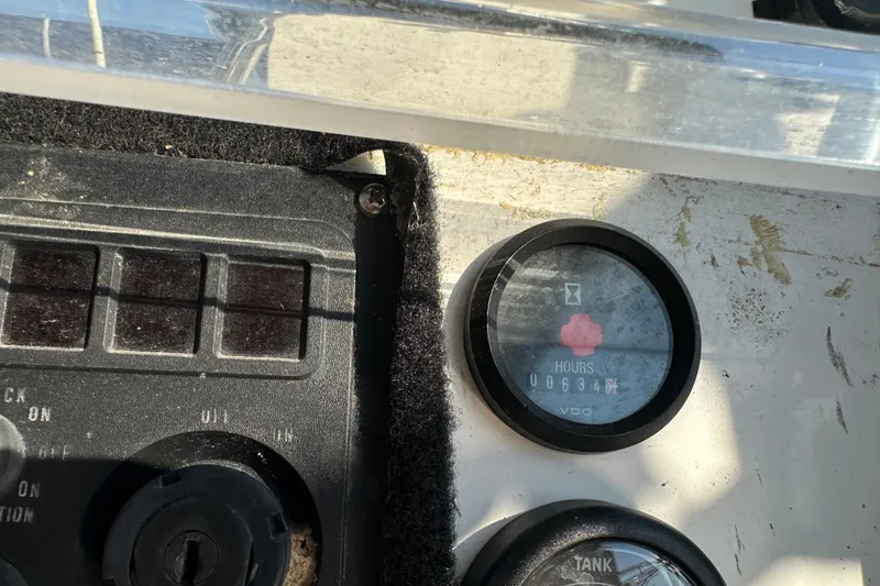 Slide: The Image of Control panel of a 2004 Beneteau 361 sailboat showing engine hours. - 12