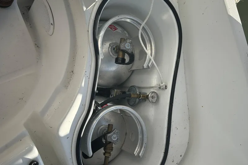Slide: The Image of Propane tanks in a 2004 Beneteau 361 sailboat storage compartment. - 13