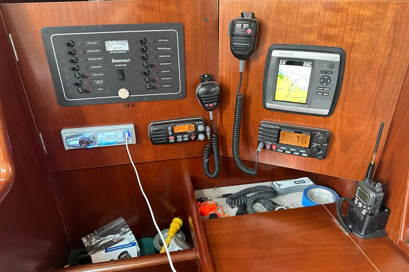 Slide: The Image of Control panel of a 2004 Beneteau 361 sailboat with navigation and communication equipment. - 31