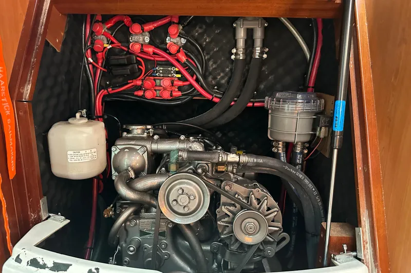 Slide: The Image of Engine compartment of a 2004 Beneteau 361 sailboat, showcasing wiring and components. - 36