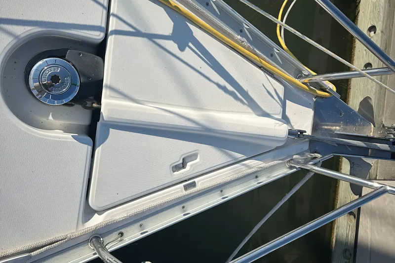 Slide: The Image of Deck view of a 2004 Beneteau 361 sailboat, featuring winch and railing details. - 8