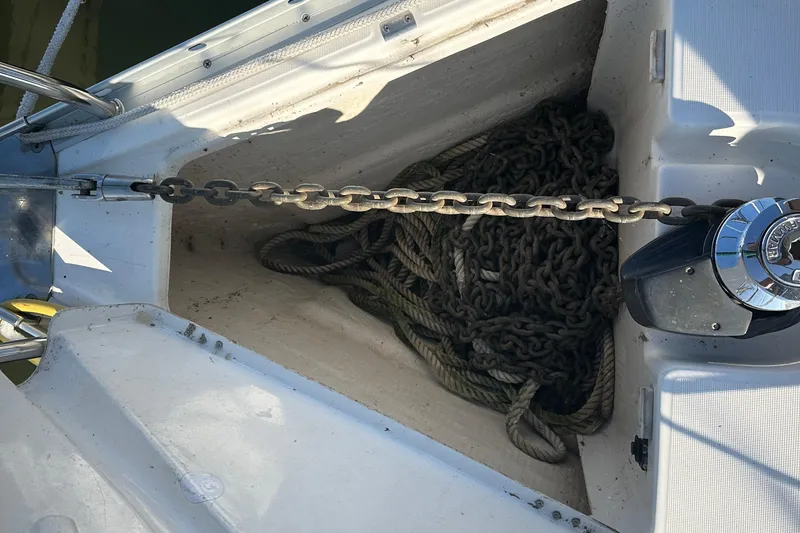 Slide: The Image of Anchor chain and rope in the bow of a 2004 Beneteau 361 sailboat. - 9