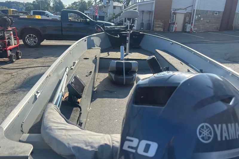 Slide: The Image of 2013 Lund 1600 Fury Tiller boat with Yamaha motor in a parking lot. - 5