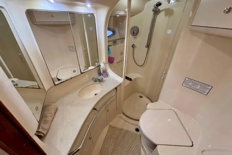 Slide: The Image of Luxurious bathroom in 2003 Sea Ray 480 Sedan Bridge yacht, featuring modern amenities and elegant design. - 34