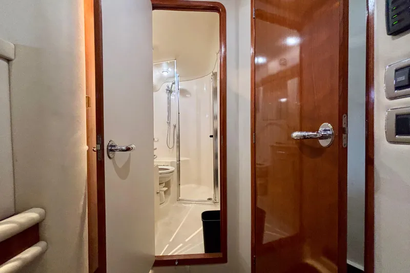 Slide: The Image of Interior view of 2003 Sea Ray 480 Sedan Bridge yacht bathroom with shower and toilet. - 41