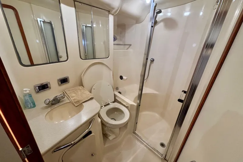 Slide: The Image of Luxurious bathroom in 2003 Sea Ray 480 Sedan Bridge yacht with shower and vanity. - 42