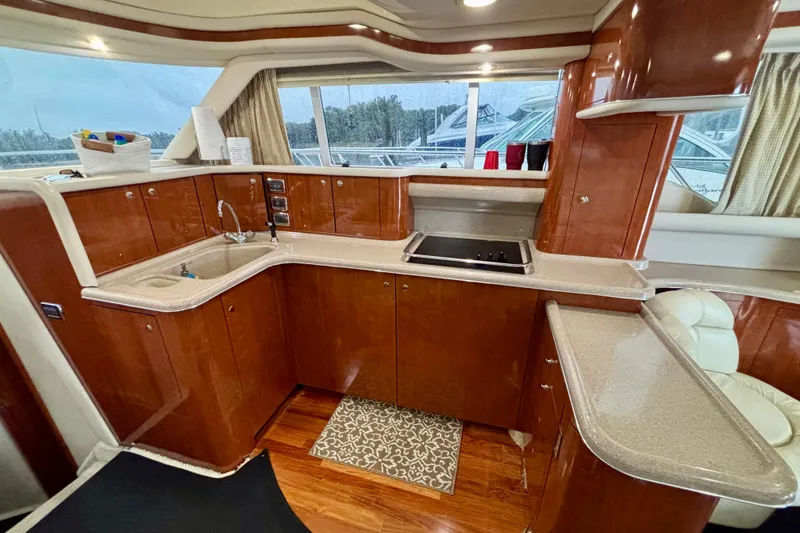 Slide: The Image of Luxurious kitchen interior of 2003 Sea Ray 480 Sedan Bridge yacht. - 50