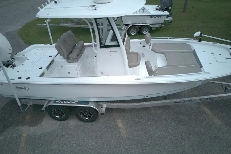 Slide: The Image of 2025 Sea Hunt BX 25 FS boat on trailer, featuring spacious seating and modern design. - 11