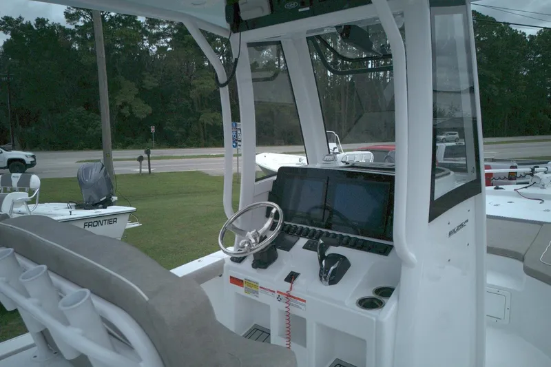Slide: The Image of 2025 Sea Hunt BX 25 FS boat interior with modern dashboard and steering wheel. - 4