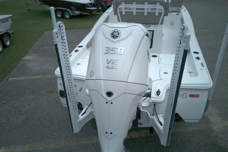 Slide: The Image of 2025 Sea Hunt BX 25 FS boat with Yamaha 350 V6 engine, parked on pavement. - 7